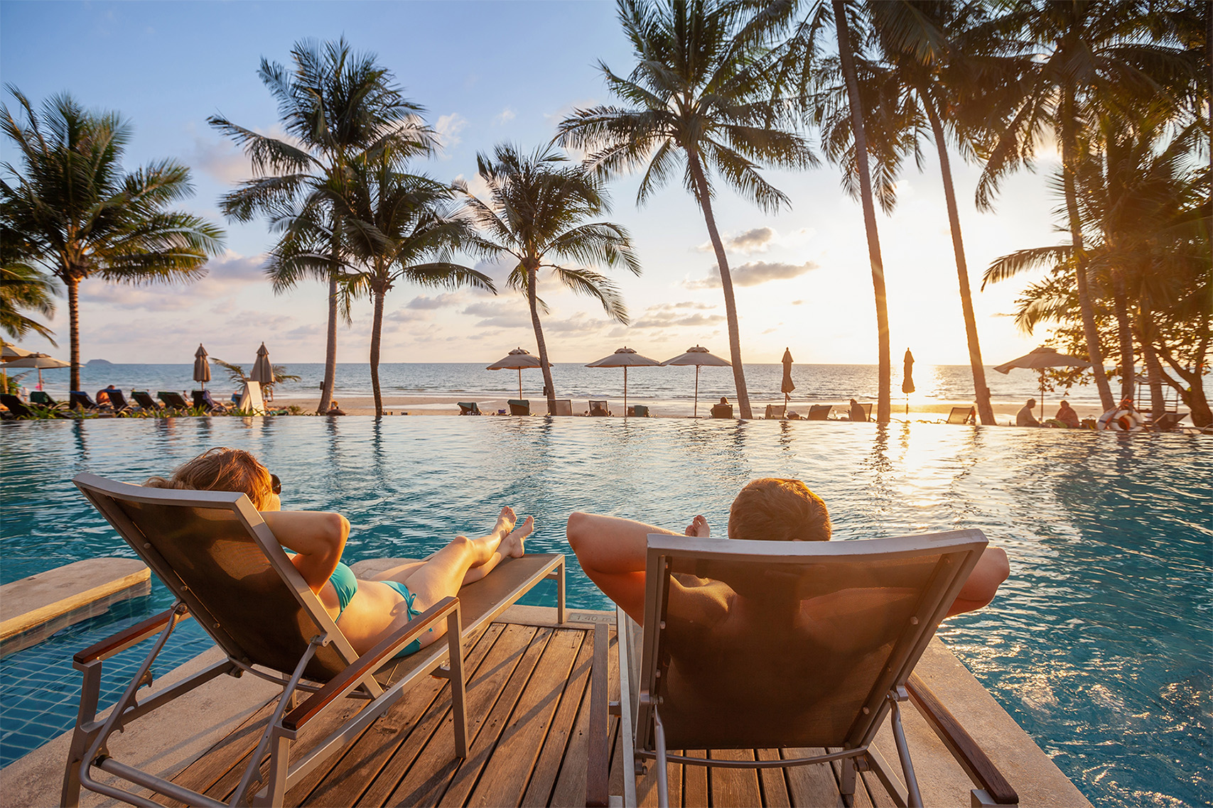 Canadian on beach vacation with travel insurance